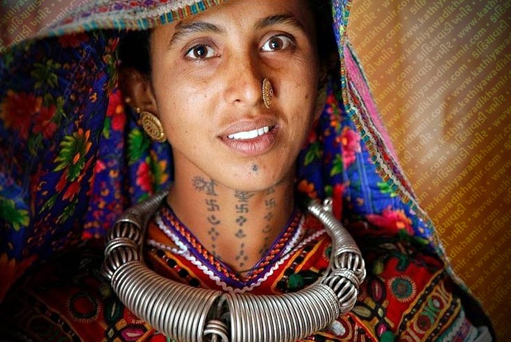 A Gujarati woman in the former Portuguese colony of Diu, India. The woman  has typical tattoo markings on her forearm Stock Photo - Alamy